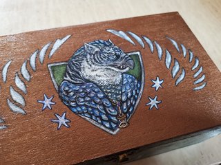 Gryph top of Box